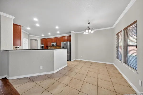 a view of a kitchen with the sink and cabinets