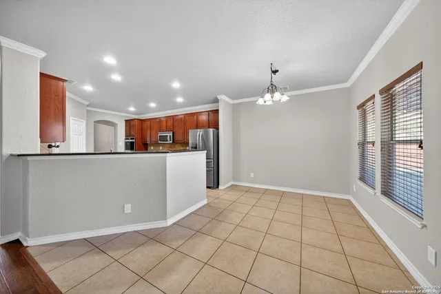 a view of a kitchen with the sink and cabinets