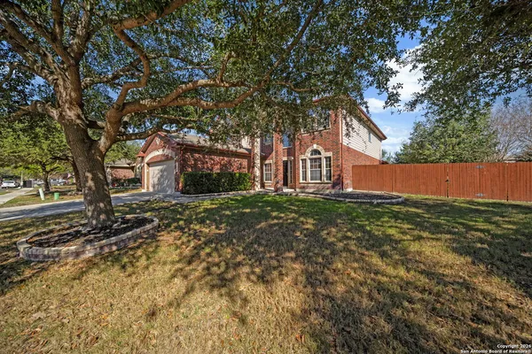 front view of a house with a tree