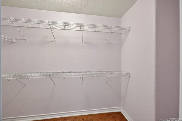 a view of a room with racks on the wall