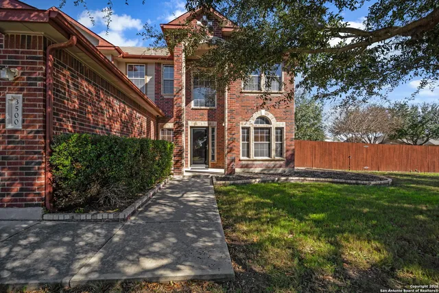 a view of house with yard