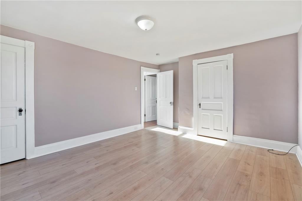 711 9th Avenue Irwin, PA 15642 - Photo 15 of 26 a view of an empty room with wooden floor