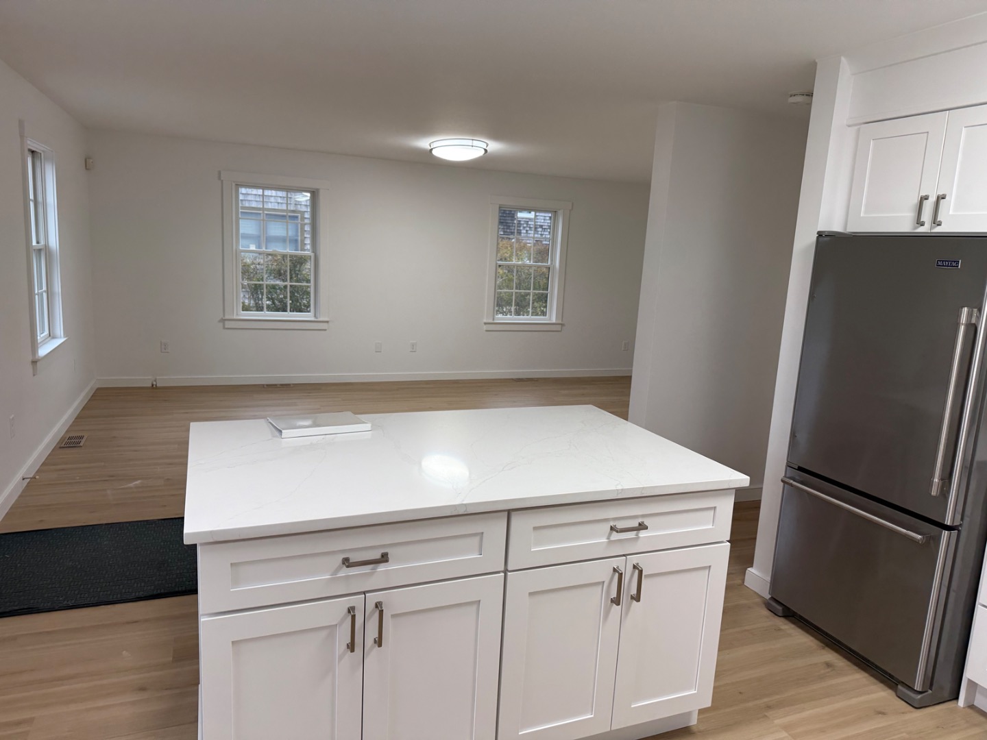 106 Old South Road, Unit A B Nantucket, MA 02554 - Photo 11 of 24 a kitchen with cabinets and stainless steel appliances