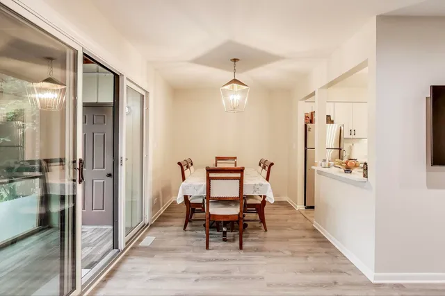 a dining room with furniture and window