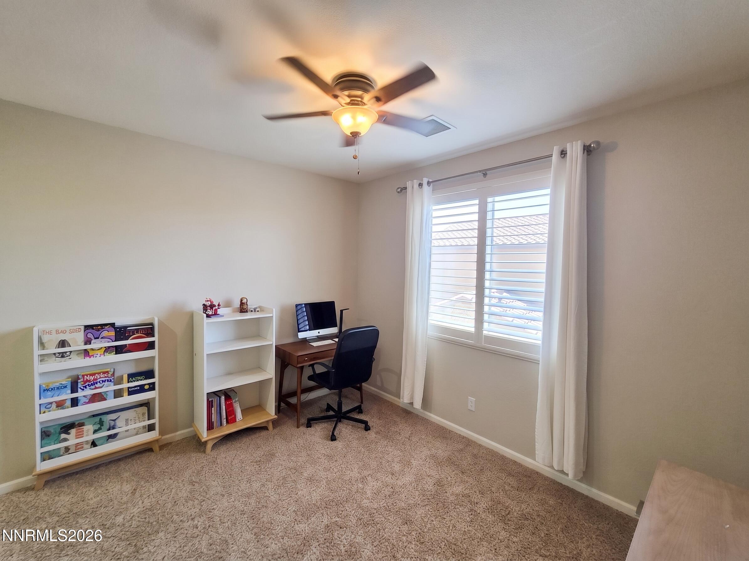 2775 Bonfire Lane Reno, NV 89521 - Photo 30 of 41 a view of a workspace with furniture and a window