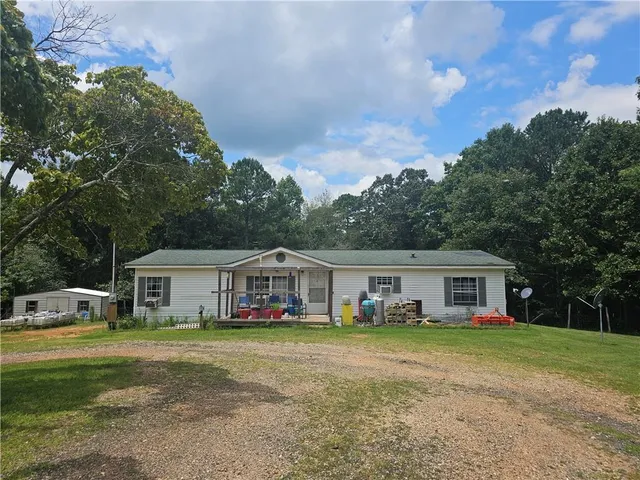 a view of house with outdoor space