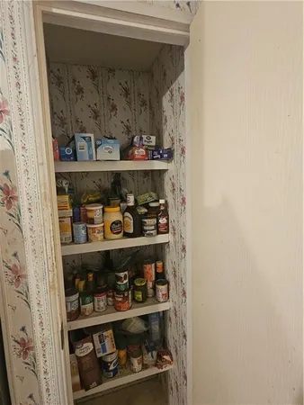 a kitchen with granite countertop a sink stainless steel appliances and cabinets