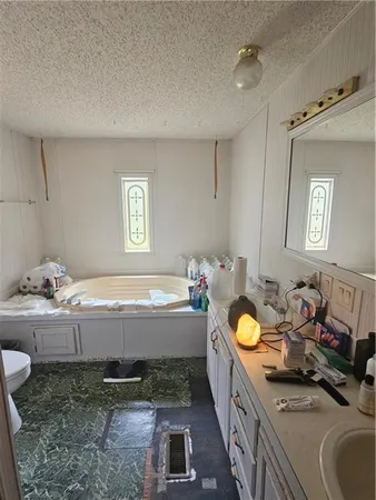 a bedroom with bed or couch and a chandelier