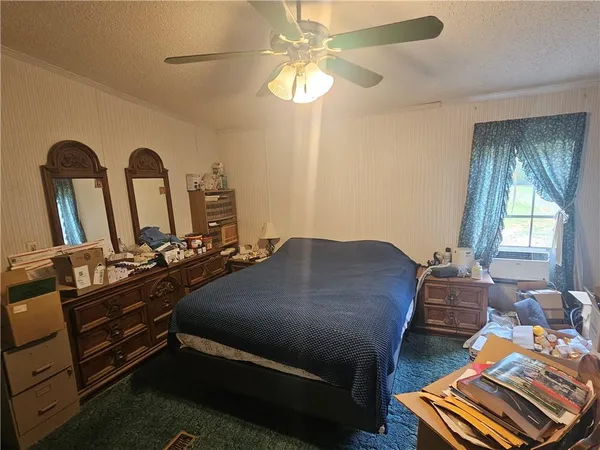 a kitchen with stainless steel appliances kitchen island granite countertop a sink stove and refrigerator