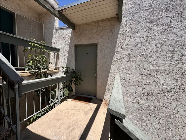 a view of balcony with furniture