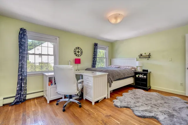 a bed room with a bed and a desk