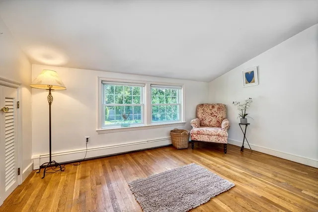a living room with furniture and a rug