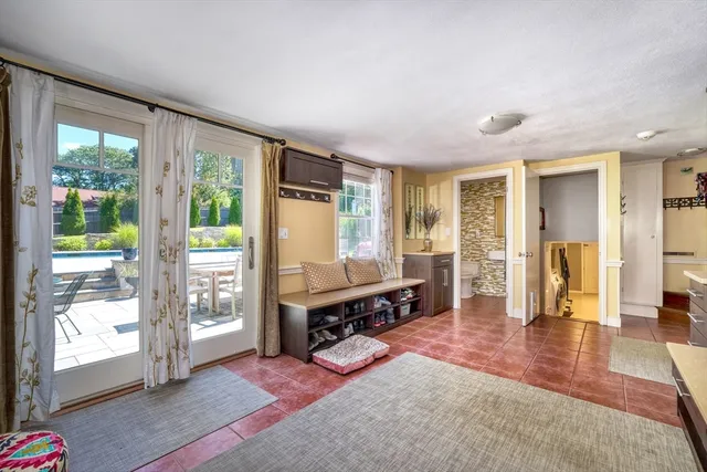 a view of a livingroom with furniture and a window