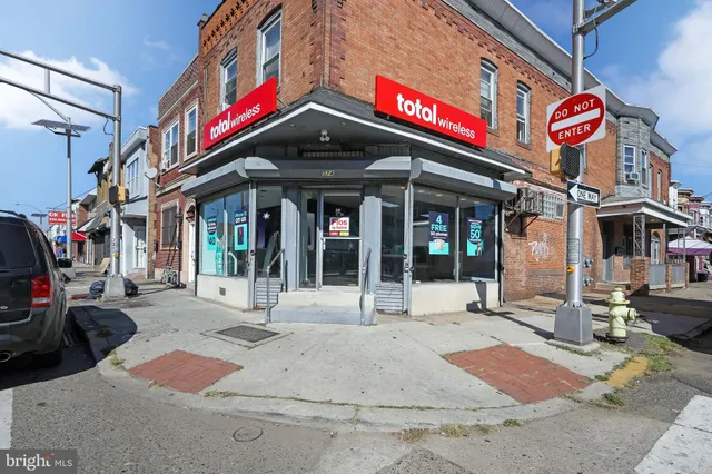 a view of a building with traffic signal lights