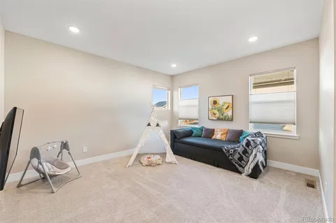 a living room with a couch and a window