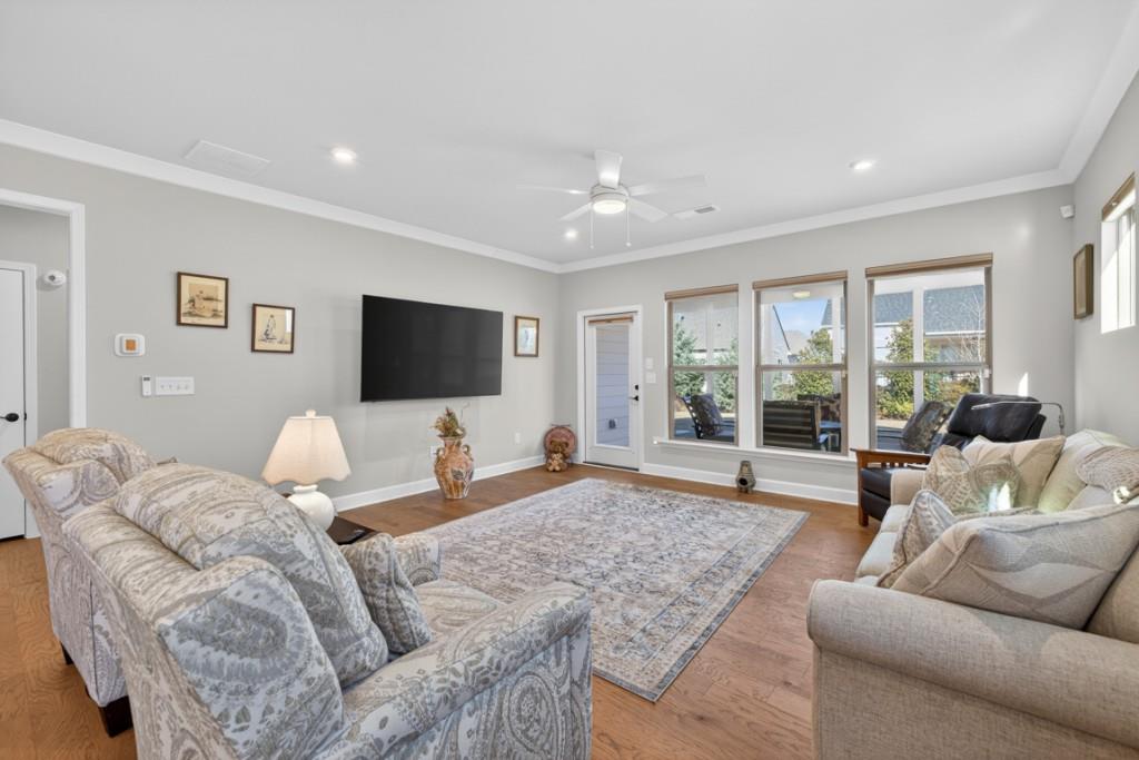 5162 Morrell Road Hoschton, GA 30548 - Photo 18 of 53 a living room with furniture and a flat screen tv
