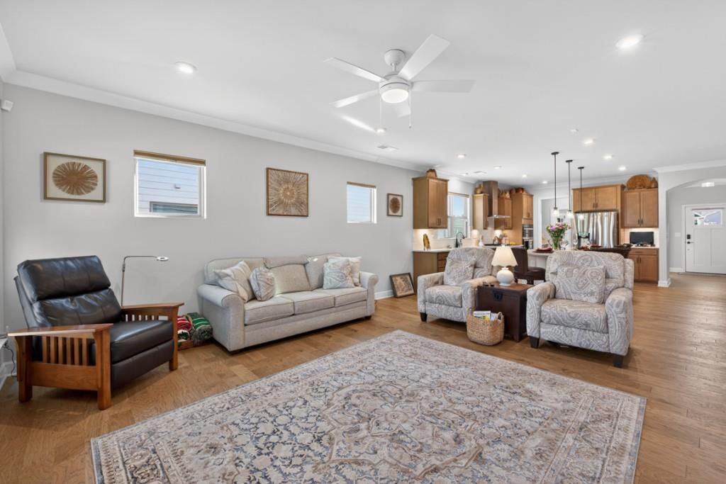 5162 Morrell Road Hoschton, GA 30548 - Photo 19 of 53 a living room with furniture and a couch