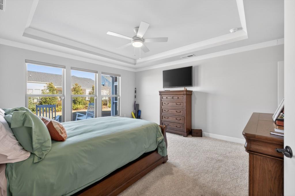 5162 Morrell Road Hoschton, GA 30548 - Photo 22 of 53 a bedroom with a bed and a television