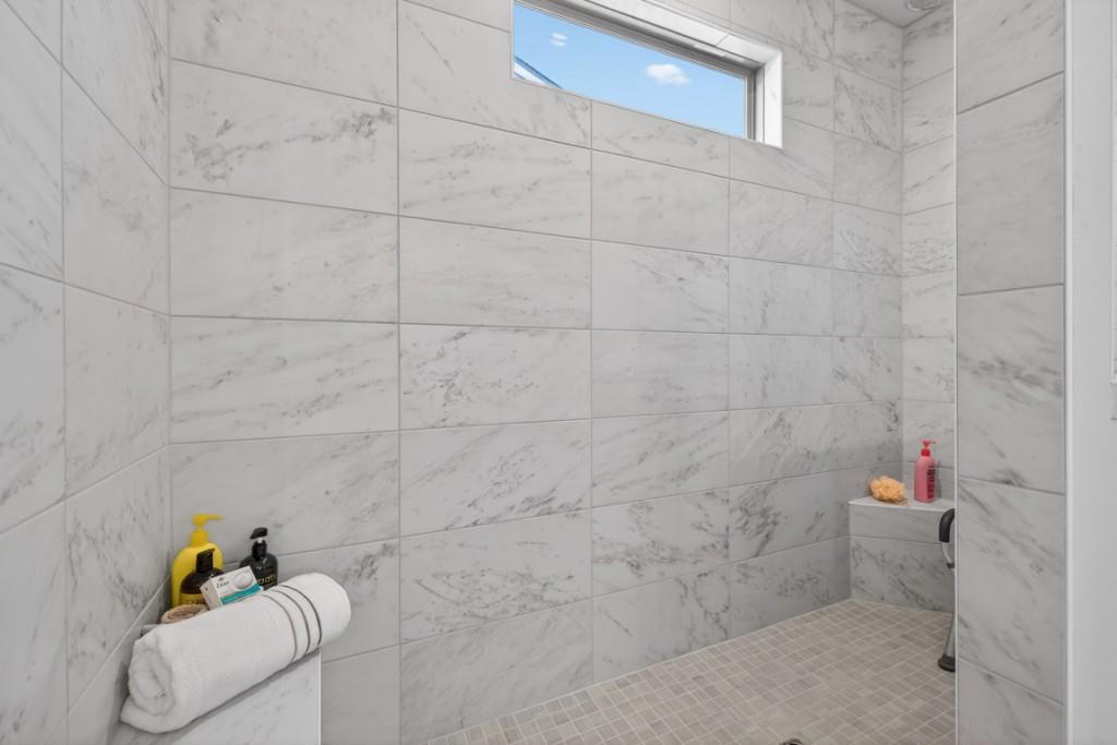 5162 Morrell Road Hoschton, GA 30548 - Photo 24 of 53 a bathroom with a bathtub