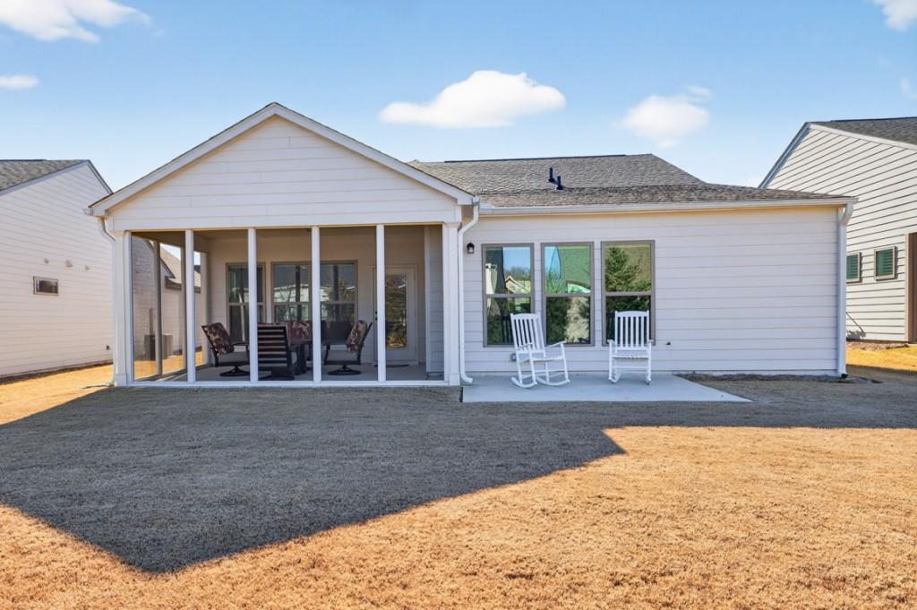 5162 Morrell Road Hoschton, GA 30548 - Photo 37 of 53 front view of a house with a yard