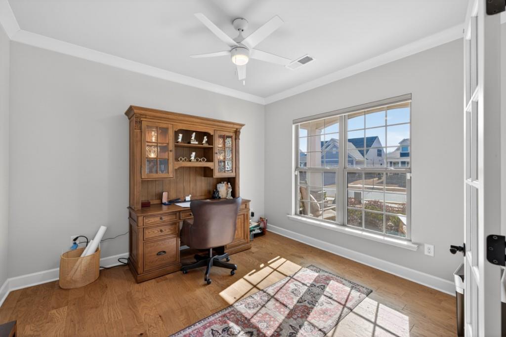 5162 Morrell Road Hoschton, GA 30548 - Photo 6 of 53 a workspace with wooden floor and a window