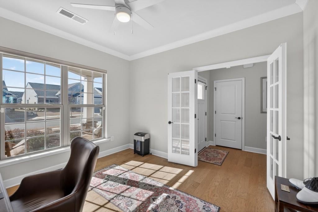 5162 Morrell Road Hoschton, GA 30548 - Photo 7 of 53 a bedroom with a bed and glass window