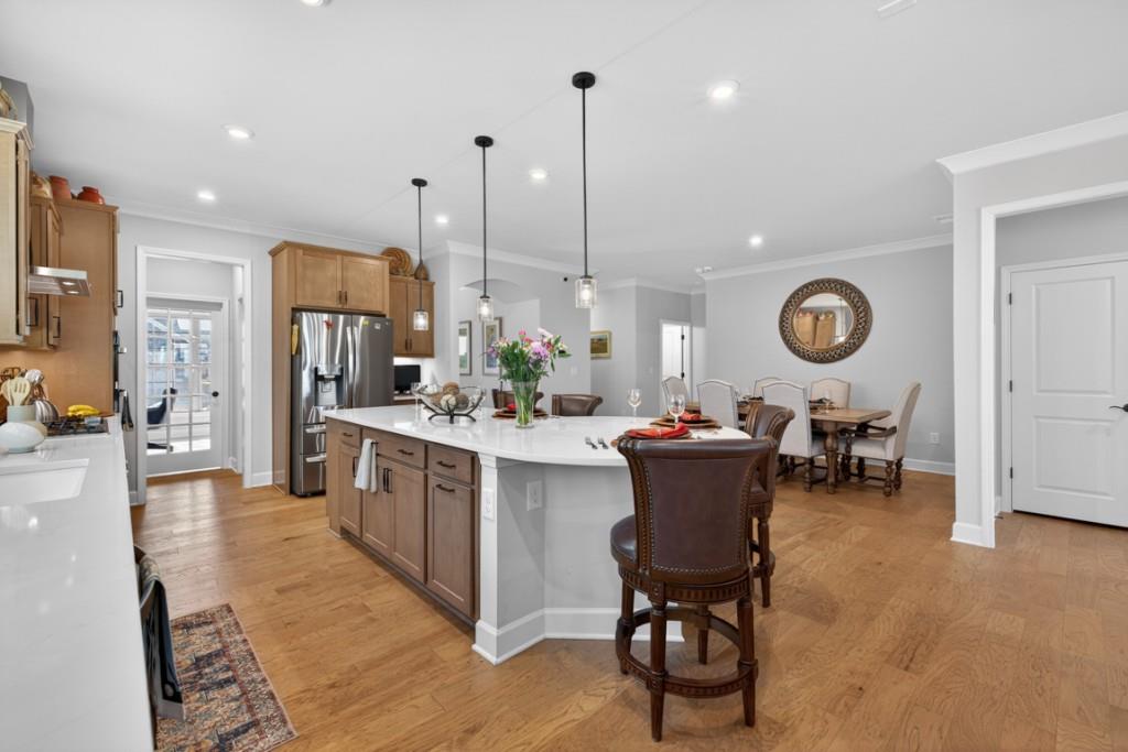 5162 Morrell Road Hoschton, GA 30548 - Photo 10 of 53 a large kitchen with a table and chairs