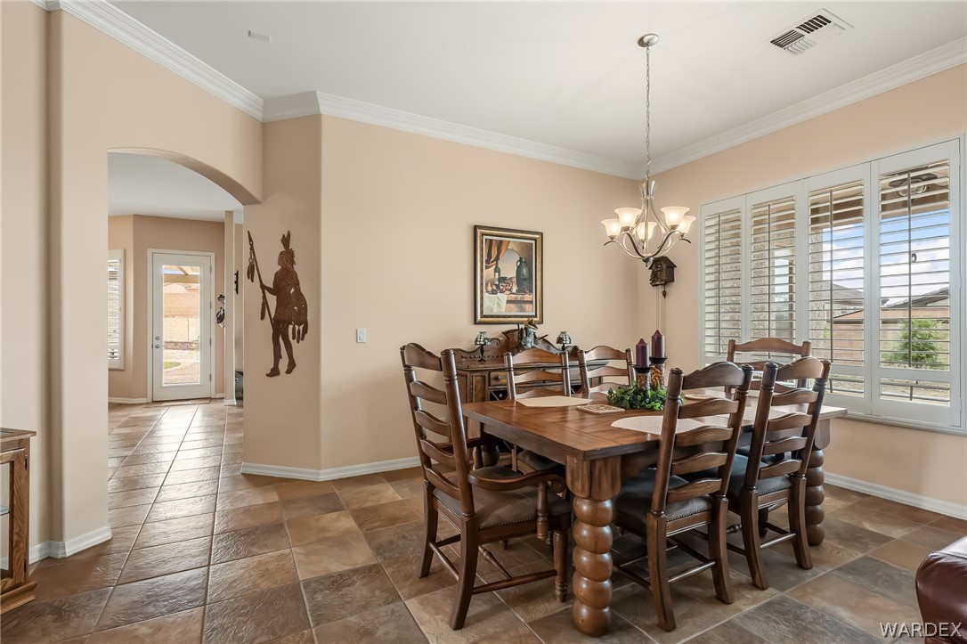 2708 Discovery Road Bullhead City, AZ 86442 - Photo 19 of 90 a view of a dining room with furniture and window