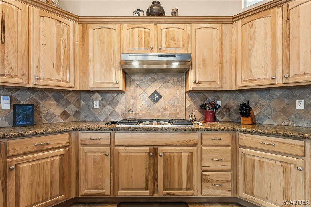 2708 Discovery Road Bullhead City, AZ 86442 - Photo 24 of 90 a kitchen with granite countertop a sink and cabinets