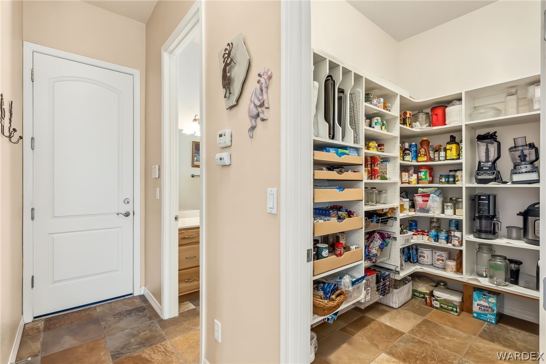 2708 Discovery Road Bullhead City, AZ 86442 - Photo 28 of 90 a view of walk in closet with clothes and shoes