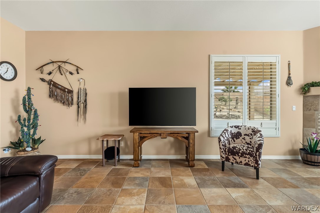 2708 Discovery Road Bullhead City, AZ 86442 - Photo 35 of 90 a living room with furniture and a flat screen tv
