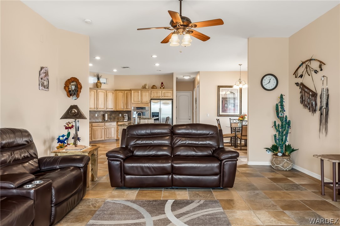 2708 Discovery Road Bullhead City, AZ 86442 - Photo 36 of 90 a living room with furniture ceiling fan and a rug