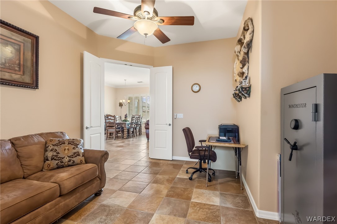 2708 Discovery Road Bullhead City, AZ 86442 - Photo 40 of 90 a living room with furniture and a chandelier