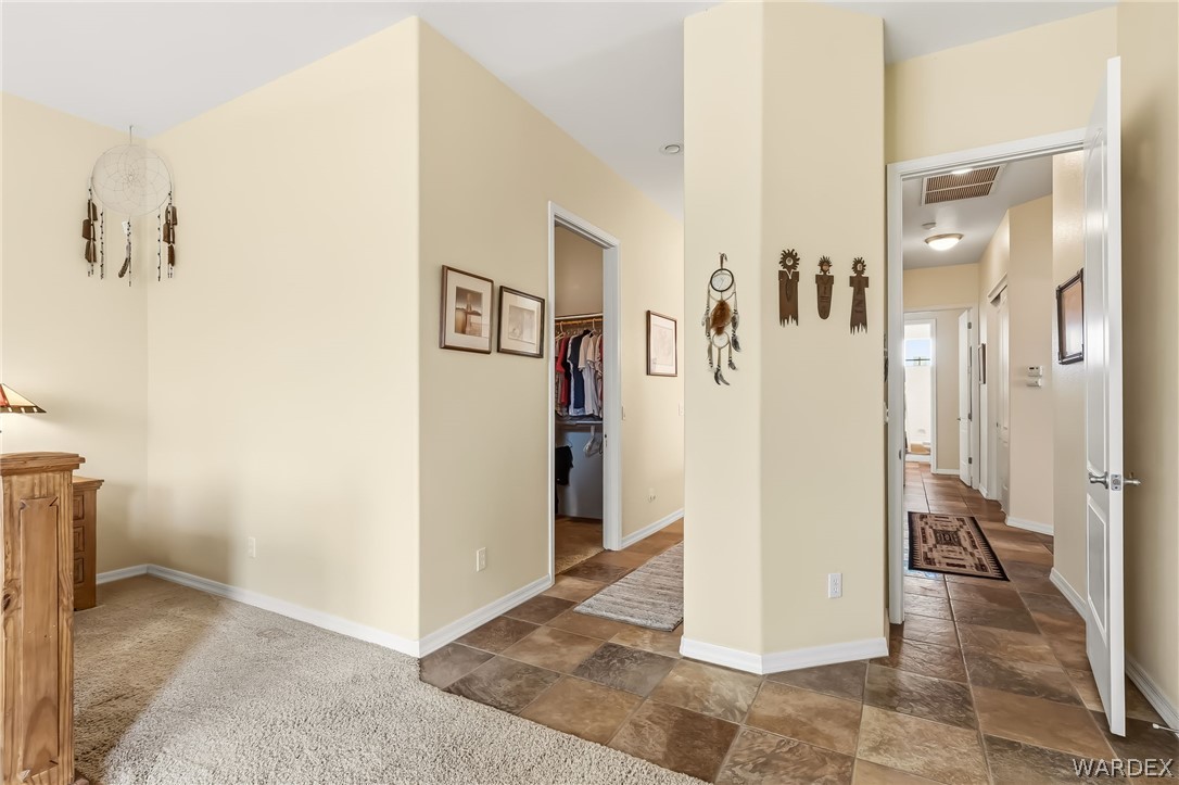 2708 Discovery Road Bullhead City, AZ 86442 - Photo 42 of 90 The property features a combination of carpet and tile flooring, with a hallway leading to various rooms