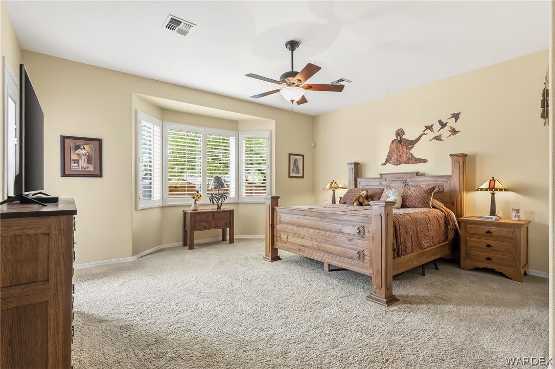 2708 Discovery Road Bullhead City, AZ 86442 - Photo 43 of 90 a bed room with a bed and a chandelier