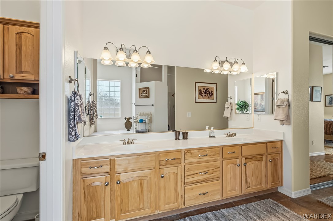 2708 Discovery Road Bullhead City, AZ 86442 - Photo 46 of 90 a bathroom with a sink double vanity granite and a mirror