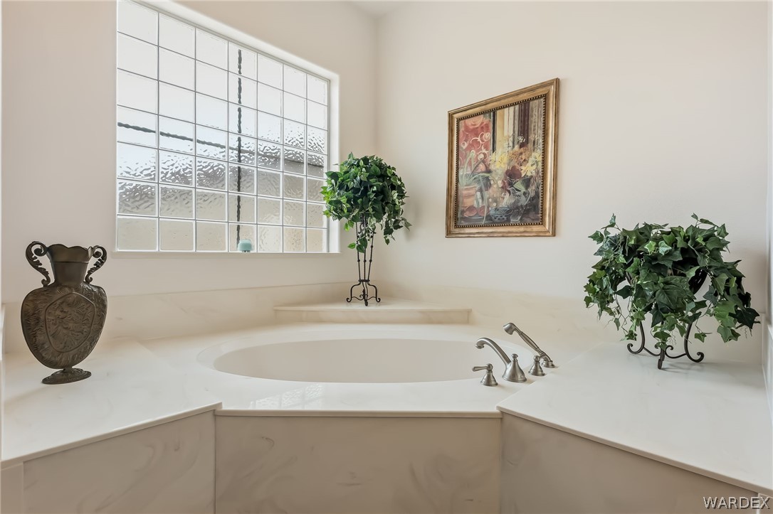 2708 Discovery Road Bullhead City, AZ 86442 - Photo 48 of 90 a bathroom with a tub sink and mirror