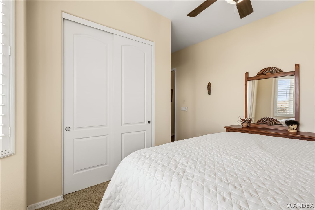 2708 Discovery Road Bullhead City, AZ 86442 - Photo 56 of 90 a bedroom with a bed and a large mirror