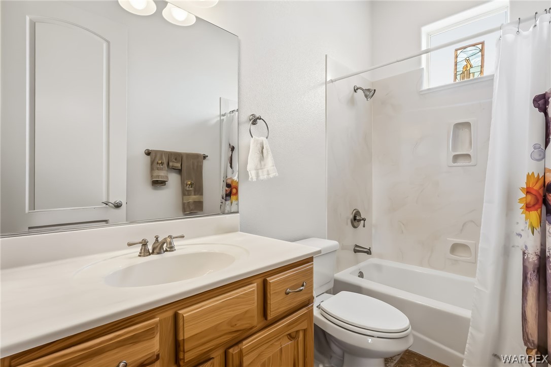 2708 Discovery Road Bullhead City, AZ 86442 - Photo 60 of 90 a bathroom with a granite countertop sink toilet and shower