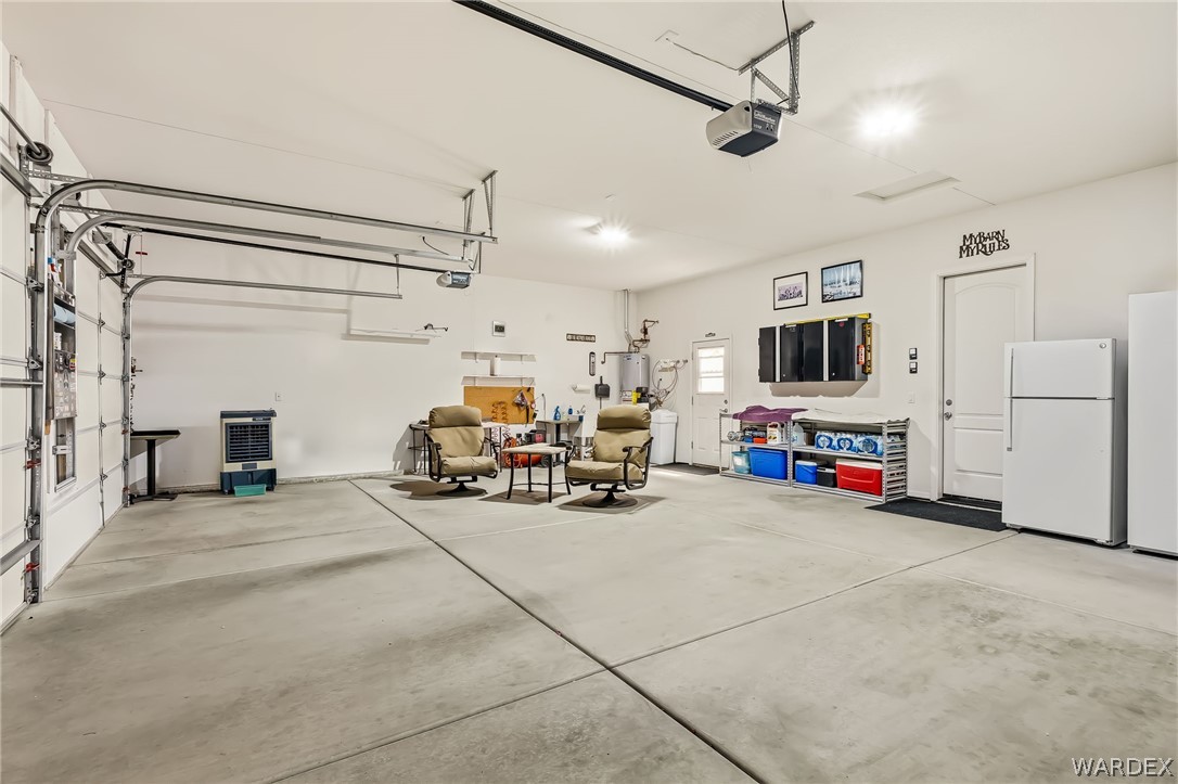 2708 Discovery Road Bullhead City, AZ 86442 - Photo 64 of 90 a view of a livingroom with furniture and a garage