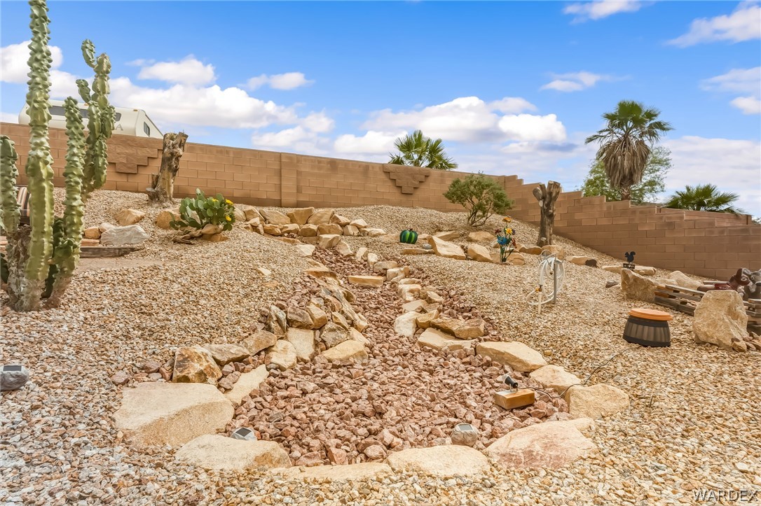 2708 Discovery Road Bullhead City, AZ 86442 - Photo 72 of 90 The property features a desert landscape with various cacti and other plants