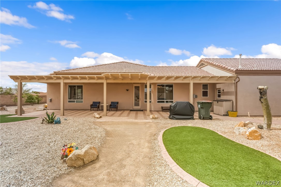 2708 Discovery Road Bullhead City, AZ 86442 - Photo 73 of 90 a view of a house with backyard sitting area and porch