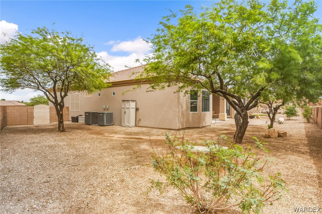 2708 Discovery Road Bullhead City, AZ 86442 - Photo 78 of 90 The property features an exterior with a tan stucco finish and a terracotta tile roof