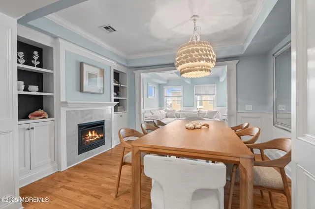 a dining room with a table a table and chairs