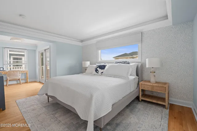 a bedroom with furniture and a window