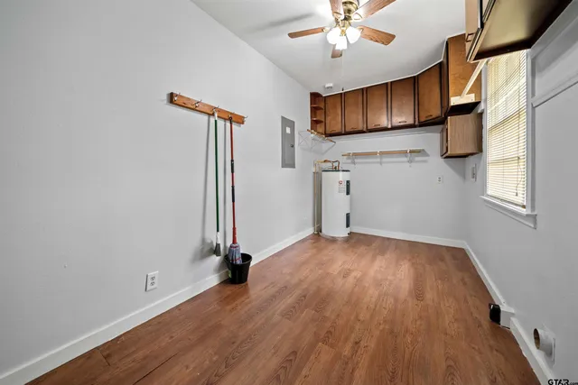 a view of kitchen with furniture and wooden floor