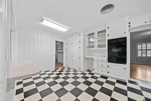 a black and white checkered floor with a black white checkered floor