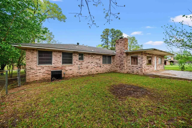 a front view of house with yard and seating area