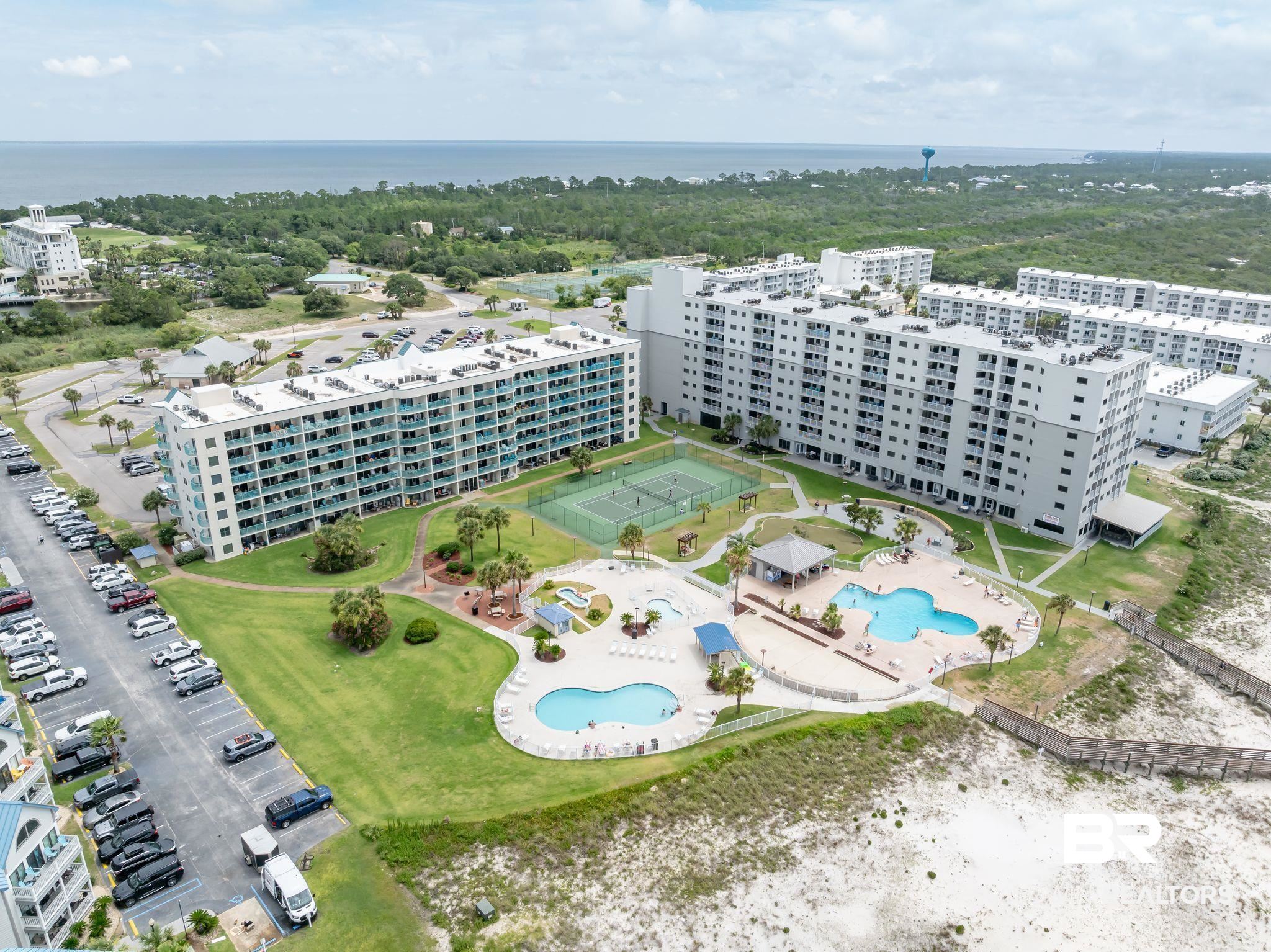 375 Plantation Road, Unit 5304 Gulf Shores, AL 36542 - Photo 40 of 42 Drone / aerial view of a pool and a nearby body of water
