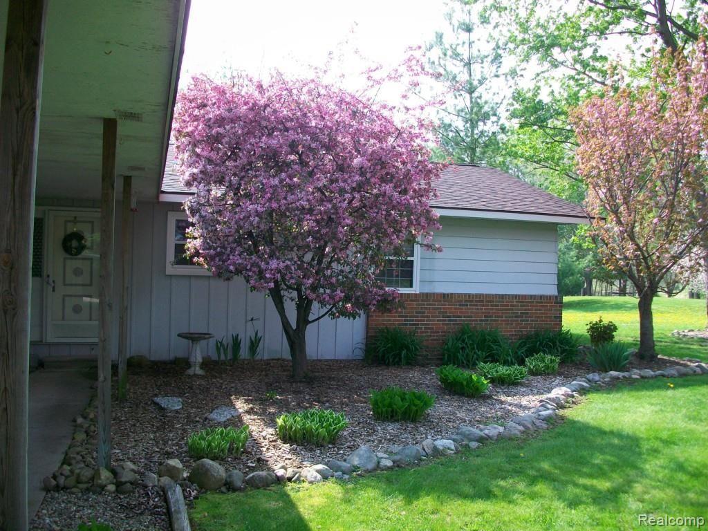 7305 Crofoot Road Fowlerville, MI 48836 - Photo 2 of 36 Flowering trees and perennials everywhere!